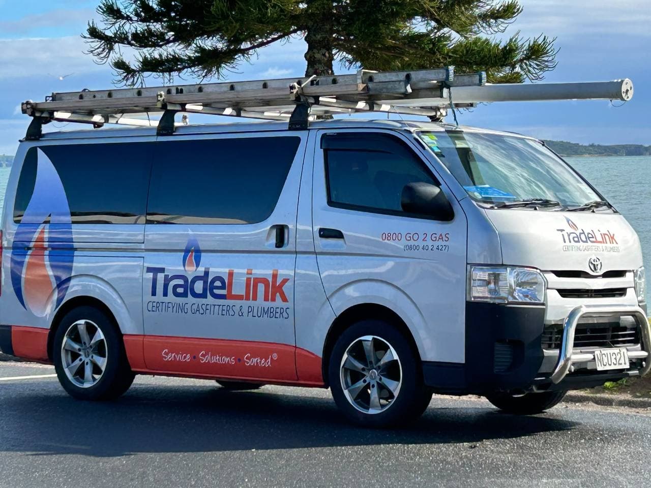 Tradelink service van parked beside the waterfront
